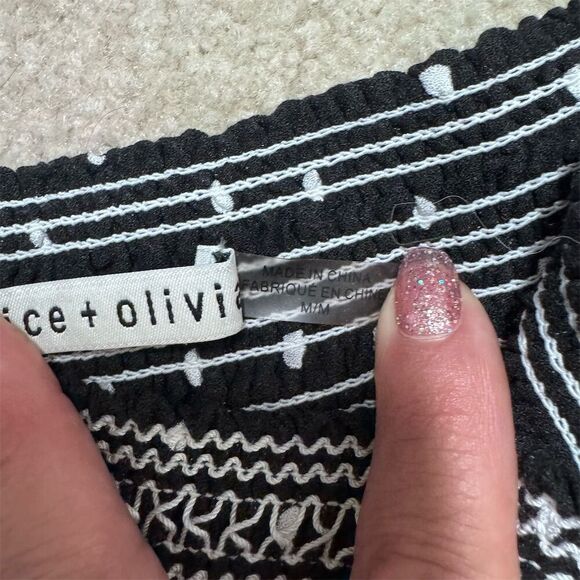 EUC Alice + Olivia Women's Black Polka Dot Mini Skirt Size M - Picture 3 of 6